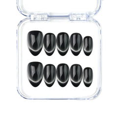 Naillover Midnight Gaze handmade Singapore press on nails in sleek black with soft cat eye shimmer and almond shape.