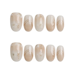 Product display of Naillover’s short oval greige press-on nail set with refined shimmer