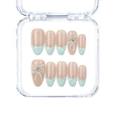 Naillover Mint Chic handmade Singapore press on nails with nude base, mint green gradient tips, and pearl bow accents.