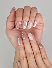 Close-up of Naillover Misty Rose Singapore press on nails showing elegant cat eye shimmer and delicate sparkle.