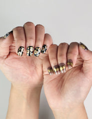 Hand pose with Mystic Flow handmade press on nails, featuring abstract color blend and opulent metallic accents