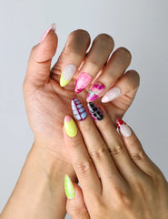 Close-up of Naillover’s colorful handmade nails with saturated tones and a smooth glossy finish