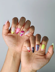 Side view of bright multi-tone press-on nails in almond shape, showcasing Singapore craft and modern color blocking