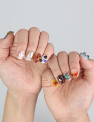 Model showing Naillover Amber Whisper nails, a perfect Singapore press on nails look for both casual and formal wear.