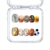 Naillover Amber Whisper handmade press on nails featuring earthy amber and olive tones with a glossy finish, from our Singapore press on nails collection.