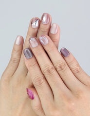 Wearing Naillover Amethyst Shimmer nails with cat eye shimmer and soft purple gradient.