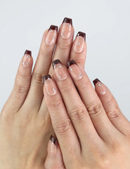 Model wearing Naillover Bare Crystal — handmade press on nails with translucent amber tones and delicate crystal accents.