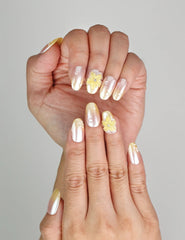 Close-up of Naillover Bloom Whimsy 3D summer nails showing delicate peach hues and floral detail.