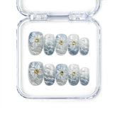 Naillover handmade press on nails in ocean-inspired blue with floral accents, Blue Blossom 3D summer nails from Singapore.