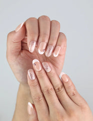 Close-up of Blush Bowlet Singapore press on nails showing French tips and champagne bows from Naillover.