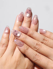 Wearing Blush Diamond Whisper handmade blush pink press on nails with gold and silver glitter by Naillover Singapore.