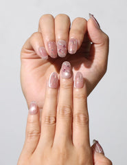 Close-up of Blush Diamond Whisper coquette Singapore press on nails with glitter accents by Naillover.