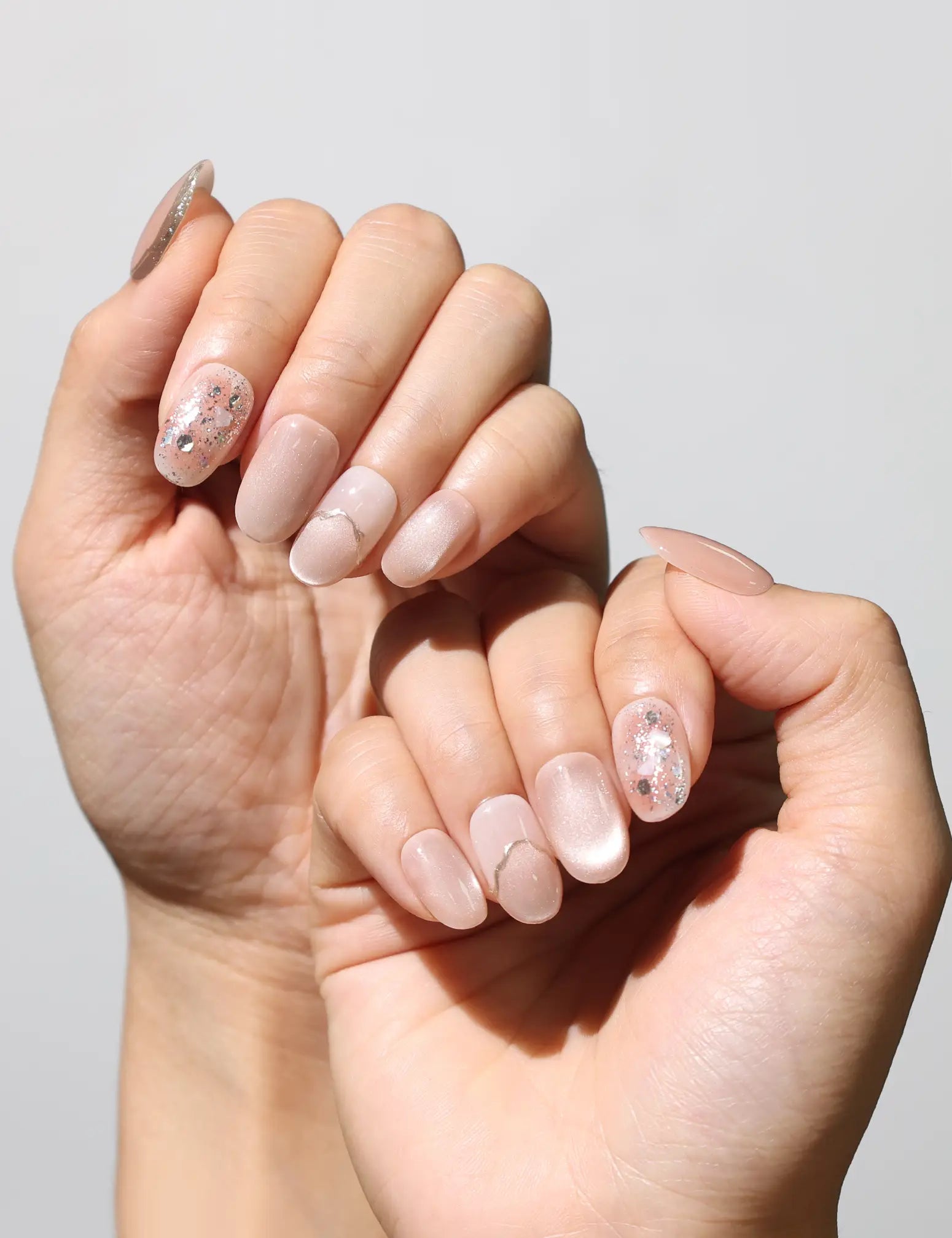 Elegant manicure featuring Blush Gemlet Gleam sheer pink gradient Singapore press on nails by Naillover.