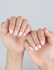 Model hand showing Naillover Singapore press on nails in Blush Gold—elegant summer nail design with gold shimmer.