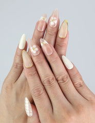 Model hand wearing Naillover Blush Lattice press on nails — almond-shaped blush gradient nails with summer elegance, handmade in Singapore.