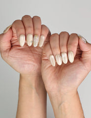 Naillover Cappuccino Daisy press on nails styled with outfit, highlighting chic floral elegance.