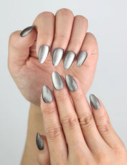 Close-up of fingers with handmade Chestnut Tone press on nails showing subtle cat eye shimmer.