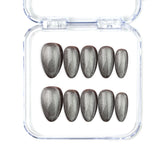 Short almond silver press on nails with cat eye shimmer, handmade by Naillover in Singapore.