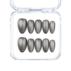 Short almond silver press on nails with cat eye shimmer, handmade by Naillover in Singapore.