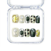 Naillover Chic Contrast handmade press on nails in black and white with dried flowers and gold foil, part of Singapore press on nails collection.