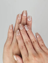 Hand wearing Naillover Chic Shimmer Singapore press on nails, nude base with gradient shimmer for everyday elegance