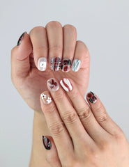 Close-up of Chocolate Plaid handmade press on nails by Naillover—trendy Singapore nail design with burgundy flowers and stripe detail.