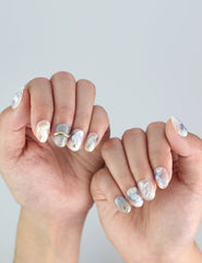 Hand with Clear Gleam nails from Naillover's Singapore press on nails range, highlighting classic marble styling.
