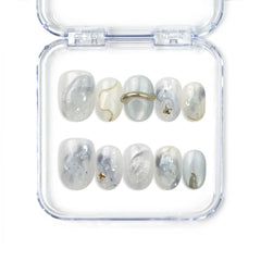 Naillover handmade press on nails with marble white and grey finish and gold accents from the Singapore press on nails collection.