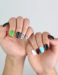 Stylish manicure featuring Cocoa Cow Mix handmade Singapore press on nails with cow pattern and brown tones.