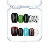 Short coffin handmade press on nails in brown tones with cow print and colorful accents by Naillover Singapore.