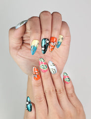 Close-up of Cosmo Glam Singapore press on nails by Naillover featuring bold Y2K colors and playful designs