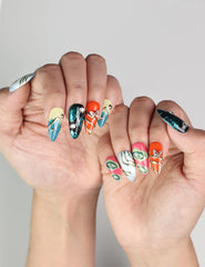 Hand pose with Cosmo Glam handmade Singapore press on nails showcasing vibrant retro patterns
