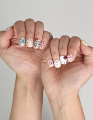 Naillover Cozy Hugs cute handmade press on nails styled with a casual look, featuring colorful whimsical accents.
