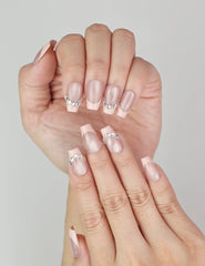 Close-up of Naillover handmade Crystal Crescent classic nails showing elegant crystal detail