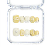 Flat lay of Naillover Daisy Glow Singapore press on nails with soft pastel base and minimalist daisy accents, handmade for a fresh, natural finish.