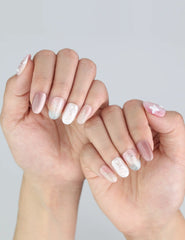 Close-up of Dusk Butterfly press on nails in an everyday elegant look with floral accents.