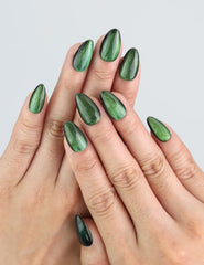 Wearing Emerald Optic green cat eye press on nails by Naillover Singapore.