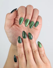 Close-up of emerald green cat eye handmade press on nails from Naillover SG.