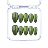 Short handmade press on nails in emerald green with cat eye effect by Naillover, Singapore.