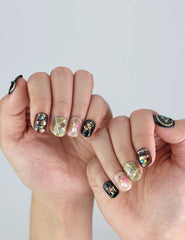 Naillover Gem Enchant nails on hand—sparkling black press on nails with Y2K-inspired 3D charm and stylish short length.