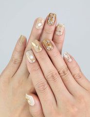 Wearing Naillover Gilded Grace 3D floral press on nails with beige tones and sculpted blossoms.