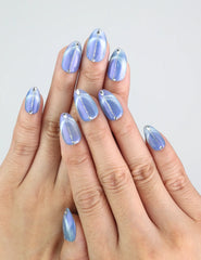 Wearing Glacier Veil cat eye press on nails in blue almond shape by Naillover.