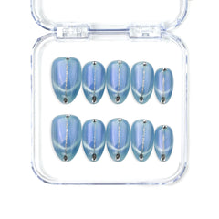 Short almond handmade press on nails in icy blue with a soft cat eye effect by Naillover, Singapore.