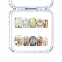 Naillover handmade press on nails in gold and floral design with pearl and gemstone accents from our Singapore press on nails collection.