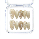 Golden Brown Floral Shine handmade press on nails by Naillover with matte and shimmering gold tones, white floral and leaf motifs — elegant Singapore press on nails.