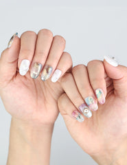 Fingers adorned with Naillover Mermaid Sparkle press ons, showing off bold Y2K-style nail art.