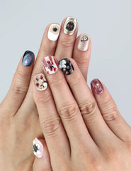 Wearing Naillover Midnight Whisper press on nails with midnight base and 3D silver flowers—an elegant, dramatic look.