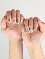 Naillover Mocha Dot cute nails design in taupe with white polka dots and bows, worn for a casual chic look