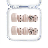 Naillover Mocha Dot Singapore press on nails in taupe with polka dots and bows, handmade cute nails design on white background