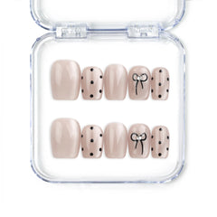 Naillover Mocha Dot Singapore press on nails in taupe with polka dots and bows, handmade cute nails design on white background